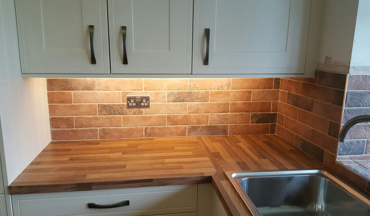 Brick style tiles finish of kitchen fitting in Cheshire